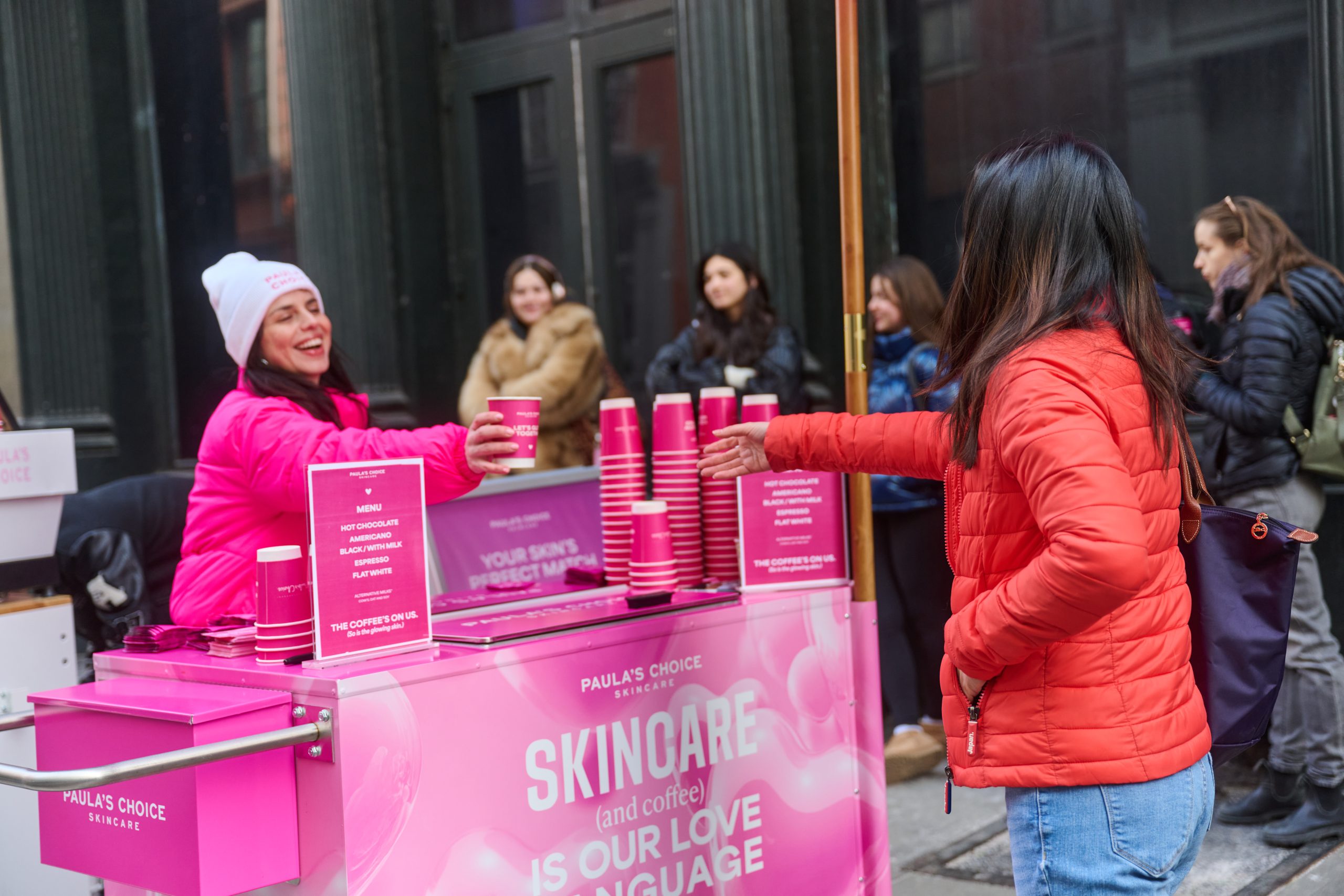 People interacting at Paula's Choice coffee cart street activation New York City